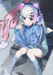  1girl absurdres animal_ear_headphones animal_ears blue_eyes blue_hair blunt_bangs cat_ear_headphones fake_animal_ears graffiti hair_ornament hairclip headphones highres hood hoodie kneehighs loose_socks mask mouth_mask multicolored_hair original pink_hair sitting sleeves_past_wrists smile socks solo streaked_hair twintails white_hair zumi_(neronero126) 