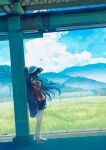  1girl barefoot black_hair black_shorts blue_sky cloud day full_body hat highres instrument_case instrument_on_back jacket kumagaya_nono long_hair mountain original outdoors red_jacket shade shorts sky sleeves_past_fingers sleeves_past_wrists solo standing sun_hat white_headwear 