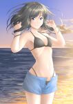  1girl bikini black_bikini black_hair blue_eyes blue_shorts cloud cloudy_sky cowboy_shot evening floating_hair hakuino_hakase hands_in_hair highres light_smile looking_at_viewer original short_shorts shorts sky swimsuit swimsuit_under_clothes twilight water 