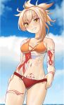  1girl absurdres arm_tattoo bare_arms bare_shoulders bikini blonde_hair blue_sky breasts cloud day english_commentary genshin_impact grin highres leg_tattoo looking_at_viewer luizhtx medium_breasts mismatched_bikini navel orange_bikini ponytail red_bikini short_hair sky smile solo stomach stomach_tattoo swimsuit tattoo thighs yellow_eyes yoimiya_(genshin_impact) 