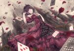  1girl :d alice_in_wonderland black_hair card castle detached_sleeves dress falling_petals floating_card flower frills gothic_lolita hair_twirling hand_on_own_chest highres lolita_fashion looking_at_viewer missile228 open_mouth petals playing_card purple_eyes queen_of_hearts_(alice_in_wonderland) red_flower red_rose rose rose_petals short_hair short_sleeves smile tiara 