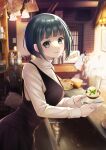  1girl black_dress closed_mouth cover cover_page cup dessert dress food green_eyes green_hair highres holding holding_plate indoors leaning_forward looking_at_viewer manga_cover megami_no_kafeterasu official_art ono_shiragiku plate seo_kouji short_hair sink solo sweater sweater_under_dress turtleneck turtleneck_sweater white_sweater 