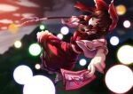  1girl ascot blurry blurry_background bow breasts brown_hair commentary full_body gohei hair_bow hakurei_reimu looking_at_viewer medium_hair ofuda open_mouth outdoors red_bow red_shirt red_skirt ribbon-trimmed_skirt ribbon-trimmed_sleeves ribbon_trim shide shirt skirt solo spell_card starraisins touhou yellow_ascot 