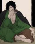  1boy aramaki_(ryokugyu) bake_ryori barefoot black_coat black_hair chest_tattoo cigarette coat covering_mouth crossed_legs curly_hair green_kimono hair_over_one_eye highres holding holding_cigarette indoors japanese_clothes kimono one_piece short_hair sitting sketch smoking stomach_tattoo tattoo 