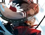  1girl arrow_(projectile) blurry bow_(weapon) brown_eyes brown_hair depth_of_field hachimaki hakama hakama_shorts headband high_ponytail highres japanese_clothes kantai_collection long_hair looking_at_viewer muneate quiver red_shorts shorts solo striped_headband sunday_aki weapon wide_sleeves zuihou_(kancolle) 