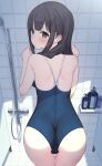  1girl ass bathroom black_hair blue_one-piece_swimsuit blush brown_eyes commentary_request cowboy_shot echiru39 from_behind highres long_hair looking_at_viewer looking_back one-piece_swimsuit original soap_bottle solo standing swimsuit thigh_gap tile_floor tile_wall tiles 
