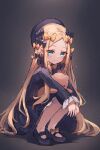  1girl abigail_williams_(fate) black_bow black_dress black_headwear blonde_hair blue_eyes blush bow breasts dress fate/grand_order fate_(series) forehead hair_bow hat highres long_hair long_sleeves looking_at_viewer miya_(miyaruta) orange_bow parted_bangs ribbed_dress sleeves_past_fingers sleeves_past_wrists small_breasts smile solo squatting stuffed_animal stuffed_toy teddy_bear 