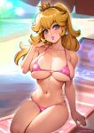  1girl arm_support bare_arms bare_shoulders beach beach_chair bikini blonde_hair blue_eyes breasts commentary_request crown day earrings hand_up head_tilt highres jewelry large_breasts lipstick long_hair looking_at_viewer makeup mario_(series) navel outdoors oyaman parted_lips pink_bikini pink_lips princess_peach single_earring sitting skindentation solo stomach sunlight swimsuit twitter_username 