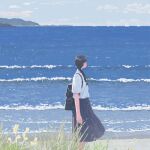  1girl arms_at_sides backpack bag black_hair blue_skirt blue_sky boat braid braided_ponytail cloud collared_shirt facing_away faux_traditional_media feet_out_of_frame flower from_side grass hair_behind_ear hayashi_naoyuki highres horizon landscape long_hair long_skirt mountain nature ocean original pleated_skirt scenery school_uniform shirt shirt_tucked_in shore short_sleeves skirt sky solo standing water watercraft white_shirt yellow_flower 