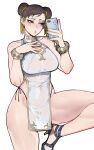  1girl absurdres bare_legs bracelet breasts brown_eyes brown_hair cellphone china_dress chinese_clothes chun-li cleavage covered_navel double_bun dress earrings gold_trim hair_bun high_heels highres holding holding_phone jewelry large_breasts panty_straps parted_lips pearl_earrings pelvic_curtain phone pink_lips ratatatat74 selfie short_dress side_slit simple_background smartphone solo street_fighter thighs white_background 