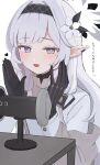  1girl asmr azuki_(az_my) binaural_microphone black_gloves black_hairband blue_archive blush flower gloves grey_hair hair_flower hair_ornament hairband halo heart highres himari_(blue_archive) long_hair long_sleeves looking_at_viewer microphone mole mole_under_eye open_mouth pointy_ears purple_eyes simple_background solo translation_request upper_body very_long_hair white_background white_flower 