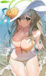  1girl absurdres arm_support beach bikini blonde_hair blue_archive blush breasts cleavage closed_mouth collarbone day flower green_eyes hair_between_eyes halo hat hat_flower highres large_breasts long_hair looking_at_viewer navel nonomi_(blue_archive) nonomi_(swimsuit)_(blue_archive) ocean official_alternate_costume outdoors scrunchie sei!cho shirt side-tie_bikini_bottom sidelocks sitting smile solo sun_hat swimsuit very_long_hair white_headwear white_shirt wrist_scrunchie yellow_bikini 