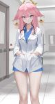  1girl absurdres blue_dress closed_mouth doctor dolri dress floppy_ears fox_girl genshin_impact hair_ornament hands_in_pockets highres hospital indoors lab_coat long_hair looking_at_viewer pink_hair pink_nails purple_eyes smile solo standing stethoscope yae_miko 