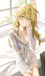  1girl ahoge bed blonde_hair blush breasts cleavage collarbone commentary_request day green_eyes grin hair_between_eyes haruri highres hoshii_miki idolmaster idolmaster_(classic) indoors long_hair long_sleeves looking_at_viewer medium_breasts pillow sleeves_past_wrists smile solo sunlight sweater white_sweater 