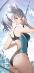  1girl absurdres animal_ear_fluff animal_ears ass bare_arms bare_shoulders black_one-piece_swimsuit blue_archive blue_eyes blue_halo blue_one-piece_swimsuit blue_sky blurry blurry_foreground breasts closed_mouth cloud commentary competition_swimsuit day earrings eucha extra_ears fishing_rod from_side grey_hair halo highres holding holding_fishing_rod jewelry low_ponytail medium_breasts multicolored_clothes multicolored_swimsuit official_alternate_costume one-piece_swimsuit outdoors shiroko_(blue_archive) shiroko_(swimsuit)_(blue_archive) sky solo stud_earrings swimsuit two-tone_swimsuit water water_drop wolf_ears 
