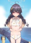  1girl ahoge amana_(pocketkey) bikini black_hair blue_archive blurry blurry_background blush bottle braid closed_mouth day flat_chest hair_ribbon halo hat hat_around_neck highres leaf leaf_on_head leaf_print long_hair looking_at_viewer messy_hair miyu_(blue_archive) miyu_(swimsuit)_(blue_archive) navel outdoors red_eyes ribbon solo straw_hat sweat swimsuit twin_braids water white_ribbon 