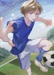  1boy absurdres ando_shiki ball blue_eyes blue_footwear blue_shirt blue_shorts grey_shorts highres light_brown_hair male_focus miya_(38magical) multicolored_clothes multicolored_shorts open_mouth paradox_live shirt short_hair short_sleeves shorts soccer soccer_ball soccer_uniform solo sportswear teeth white_footwear 