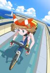  1girl bent_over bicycle bike_shorts bow_hairband brown_hair closed_mouth cloud commentary_request day eyelashes fanny_pack grey_eyes hairband highres holding ia_(ilwmael9) latias latios lighthouse may_(pokemon) ocean outdoors pokemon pokemon_(game) pokemon_oras riding riding_bicycle shirt shoes sky sleeveless sleeveless_shirt smile split_mouth water yellow_bag yellow_footwear 