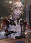  1boy :d black_gloves blonde_hair blurry blurry_background blurry_foreground cape card chalice commentary_request cup depth_of_field earrings eyelashes fang feather_hair_ornament feathers fingerless_gloves genius_invokation_tcg genshin_impact gloves gold_trim greentea7954 hair_between_eyes hair_ornament hand_up highres indoors jewelry kaveh_(genshin_impact) light_particles long_hair long_sleeves looking_at_viewer male_focus necklace open_mouth parted_bangs playing_card red_cape red_eyes shirt sidelocks sitting smile solo tassel teeth upper_body upper_teeth_only white_shirt 