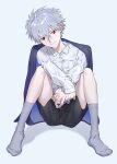  1boy black_shorts closed_mouth collared_shirt full_body grey_background grey_hair grey_socks highres long_sleeves male_focus nagisa_kaworu neon_genesis_evangelion quwo red_eyes shirt short_hair shorts sitting smile socks solo white_shirt 