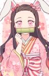  1girl alternate_costume animal_ears bamboo blush bow brown_hair covered_mouth forehead hair_bow hair_ribbon highres japanese_clothes kamado_nezuko kimetsu_no_yaiba kimono long_hair long_sleeves looking_at_viewer pink_eyes pink_kimono pink_ribbon rabbit_ears red_bow ribbon shimya solo upper_body 