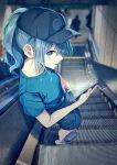  1girl alternate_costume black_headwear blue_eyes blue_hair blue_shirt blue_shorts casual cellphone commentary_request escalator from_above hair_between_eyes hat holding holding_phone hololive hoshimachi_suisei looking_at_viewer medium_hair momijiko phone ponytail shirt shorts smartphone solo t-shirt virtual_youtuber 