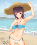  1girl alternate_hair_color arm_up armpits bare_arms bare_shoulders beach bikini blue_sky breasts brown_headwear closed_mouth cloud cloudy_sky commentary_request day dot_nose feet_out_of_frame hand_up hat highres itsuwa light_blush looking_at_viewer medium_breasts medium_hair navel ocean outdoors purple_eyes purple_hair sand shin_(highest1192) sky smile solo standing stomach straw_hat swimsuit toaru_majutsu_no_index waves 