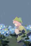  1girl animal_ear_headwear arknights black_footwear blue_eyes blue_flower blue_poison_(arknights) blush boots bucket_hat closed_mouth commentary dailybloopy flower frog from_side green_headwear green_jacket hair_between_eyes hat hydrangea jacket long_hair low_twintails outdoors pink_hair profile rain rubber_boots solo squatting twintails 