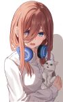  1girl absurdres animal blue_eyes blush brown_hair cat commentary_request go-toubun_no_hanayome hair_between_eyes headphones headphones_around_neck highres holding holding_animal holding_cat long_hair looking_at_viewer nakano_miku open_mouth raikun_raikun simple_background solo white_background 