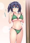  1girl bikini blue_eyes blue_hair blush breasts cleavage cowboy_shot female_pov green_bikini hair_between_eyes hair_ribbon highres kantai_collection kuromayu large_breasts looking_at_mirror looking_at_viewer mirror navel plump pov ribbon simple_background solo souryuu_(kancolle) surprised swimsuit translation_request twintails underboob white_background 