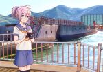  1girl aoba_(kancolle) black_thighhighs blue_eyes blue_scrunchie blue_sky bridge camera cloud cowboy_shot day hair_ornament hair_scrunchie hitakikan kantai_collection landscape looking_at_viewer mountain neckerchief outdoors pink_hair ponytail purple_sailor_collar purple_shorts railing sailor_collar sailor_shirt scrunchie ship shirt short_hair shorts sky solo thighhighs watercraft white_shirt yellow_neckerchief 