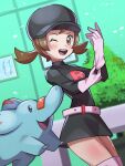  1girl adjusting_clothes adjusting_gloves belt black_headwear blush brown_eyes brown_hair bush cowboy_shot gloves highres inana_umi looking_at_viewer lyra_(pokemon) one_eye_closed open_mouth phanpy pokemon pokemon_(creature) pokemon_(game) pokemon_hgss smile solid_oval_eyes team_rocket team_rocket_uniform twintails white_gloves 