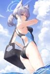  1girl absurdres animal_ear_fluff animal_ears ass bag blue_archive blue_eyes blue_halo blue_sky breasts cloud commentary competition_swimsuit cross_hair_ornament day grey_hair hair_ornament halo highres holding holding_bag long_hair looking_at_viewer medium_breasts nyun ocean official_alternate_costume one-piece_swimsuit open_mouth outdoors partially_submerged school_bag shiroko_(blue_archive) shiroko_(swimsuit)_(blue_archive) short_hair sky solo standing swimsuit twintails 