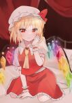  1girl absurdres ascot blonde_hair blurry blurry_background closed_mouth commentary crystal curtains flandre_scarlet full_body hat hat_ribbon highres indoors looking_at_viewer mob_cap nahoshi_(sevenstar744) on_bed rainbow_order red_eyes red_ribbon red_skirt red_vest ribbon seiza shirt short_sleeves sitting skirt smile solo touhou vest white_headwear white_shirt wings wrist_cuffs yellow_ascot 