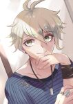  1boy amami_rantaro collarbone danganronpa_(series) danganronpa_v3:_killing_harmony green_eyes green_hair hair_between_eyes hand_on_own_chin hand_up highres jewelry long_sleeves looking_at_viewer male_focus moonku necklace ring shirt short_hair smile solo striped striped_shirt 