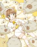  1girl bell blush brown_hair cardcaptor_sakura child dabapadayo gloves green_eyes hair_between_eyes happy highres horns kinomoto_sakura magical_girl open_mouth sheep sheep_horns simple_background wings yellow_background yellow_gloves 