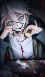  1boy :d absurdres blue_eyes candy_wrapper crazy_eyes crazy_smile danganronpa_(series) danganronpa_2:_goodbye_despair gradient_background green_jacket grey_hair hair_between_eyes hands_up highres holding jacket komaeda_nagito male_focus mbdtz messy_hair open_clothes open_jacket print_shirt shirt smile solo teeth white_shirt 