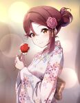  1girl amagi_(volfuji) birthday blush candy candy_apple commentary floral_print flower food hair_bun hair_flower hair_ornament highres holding holding_candy holding_food japanese_clothes kimono looking_at_viewer love_live! love_live!_sunshine!! pink_kimono red_hair sakurauchi_riko single_hair_bun solo upper_body yellow_eyes yukata 