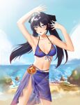  1girl absurdres anoreikatomoe aqua_eyes armpits arms_up beach bikini black_hair blue_bikini blue_sarong blue_sky breasts cloud collarbone cowboy_shot day genshin_impact highres long_hair looking_at_viewer medium_breasts mona_(genshin_impact) navel ocean open_mouth outdoors sarong sky solo stomach swimsuit twintails 