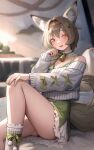  1girl :d absurdres animal_ears arknights bare_shoulders beanstalk_(arknights) beanstalk_(gift_uncompleted)_(arknights) bell commentary_request feet_out_of_frame grey_hair highres knee_up long_sleeves looking_at_viewer off-shoulder_sweater off_shoulder official_alternate_costume open_mouth orange_eyes short_hair sitting smile solo sweater tail thighs welt_(kinsei_koutenkyoku) white_sweater 