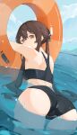  1girl afloat ass bare_shoulders bathing bikini black_bikini brown_hair day flower-shaped_pupils genshin_impact highres hu_tao_(genshin_impact) innertube long_hair looking_at_viewer looking_back lycsakd outdoors partially_submerged pool red_eyes solo swimsuit symbol-shaped_pupils water 