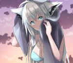  1girl ahoge animal_ear_fluff animal_ears bikini blush braid breasts commentary_request drying drying_hair dusk earrings fox_ears fox_girl green_bikini green_eyes hair_between_eyes highres holding holding_towel hololive jewelry long_hair looking_at_viewer marino1401 medium_breasts shirakami_fubuki sidelocks single_braid solo swimsuit towel virtual_youtuber wet white_hair 