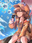  1girl anchor_symbol backpack bag birthday black_gloves blue_sky brown_eyes brown_hair bubble bubble_blowing cloud collarbone dated english_commentary fingerless_gloves gloves guilty_gear guilty_gear_strive hair_between_eyes highres jacket long_hair mariebell may_(guilty_gear) orange_headwear orange_jacket pipe_in_mouth sidelocks signature skull_and_crossbones sky smoking_pipe solo whale 