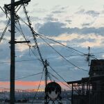  1girl absurdres antennae black_eyes black_hair building city cloud collared_shirt highres house looking_at_viewer morning original outdoors power_lines scenery shirt short_hair short_twintails sky solo sunrise twintails uniunimikan upper_body utility_pole white_shirt 