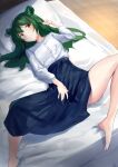  1girl absurdres akinakesu-chan animal_ear_fluff animal_ears barefoot bed blue_skirt blush breasts closed_mouth commentary commission english_commentary green_hair hand_up highres indoors long_hair long_sleeves lying on_back on_bed original pillow pixiv_commission puffy_long_sleeves puffy_sleeves romaji_commentary shirt skirt small_breasts smile solo spread_legs white_shirt yellow_eyes 