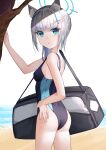  1girl absurdres animal_ear_fluff animal_ears ass bag beach black_one-piece_swimsuit blue_archive blue_eyes breasts commentary competition_swimsuit cowboy_shot cross_hair_ornament extra_ears gora_mclaren grey_hair hair_ornament halo highres looking_at_viewer low_ponytail medium_hair mismatched_pupils multicolored_clothes multicolored_swimsuit official_alternate_costume one-piece_swimsuit shiroko_(blue_archive) shiroko_(swimsuit)_(blue_archive) simple_background small_breasts solo swimsuit tree water white_background wolf_ears 