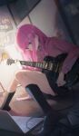  1girl absurdres bedroom black_skirt black_socks blue_eyes bocchi_the_rock! computer electric_guitar gibson_les_paul gotoh_hitori guitar highres hokushuu instrument jacket kneehighs laptop long_hair photo_(object) pink_hair pink_jacket skirt socks thighs track_jacket very_long_hair 