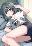  1girl akemiho_tabi_nikki aqua_eyes arm_up bare_legs bed black_shorts breasts bright_pupils collarbone day eyelashes feet_out_of_frame gendai_ninjakko_zukan grey_hair hair_between_eyes highres indoors kouno_hikaru legs_together light_blush looking_at_viewer lying medium_hair midriff_peek on_bed on_side parted_lips pillow print_shirt shirt short_sleeves shorts small_breasts solo t-shirt teeth tonomura_ruri white_shirt window 