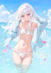  1girl bare_shoulders bikini blush collarbone commentary_request day falling_flower falling_petals flower highres long_hair long_sleeves looking_at_viewer mignon navel off_shoulder open_clothes original outdoors parted_lips partially_submerged petals purple_eyes smile solo stomach swimsuit teeth thighs water white_bikini white_hair 
