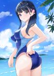  1girl adjusting_clothes adjusting_swimsuit ass beach black_hair blue_eyes blue_one-piece_swimsuit blue_sky blunt_bangs breasts cloud competition_swimsuit cowboy_shot day highres horizon long_hair looking_at_viewer looking_back medium_breasts mountainous_horizon nobita_(nbnobita) ocean one-piece_swimsuit original outdoors palm_tree sky solo swimsuit tree two-tone_swimsuit 